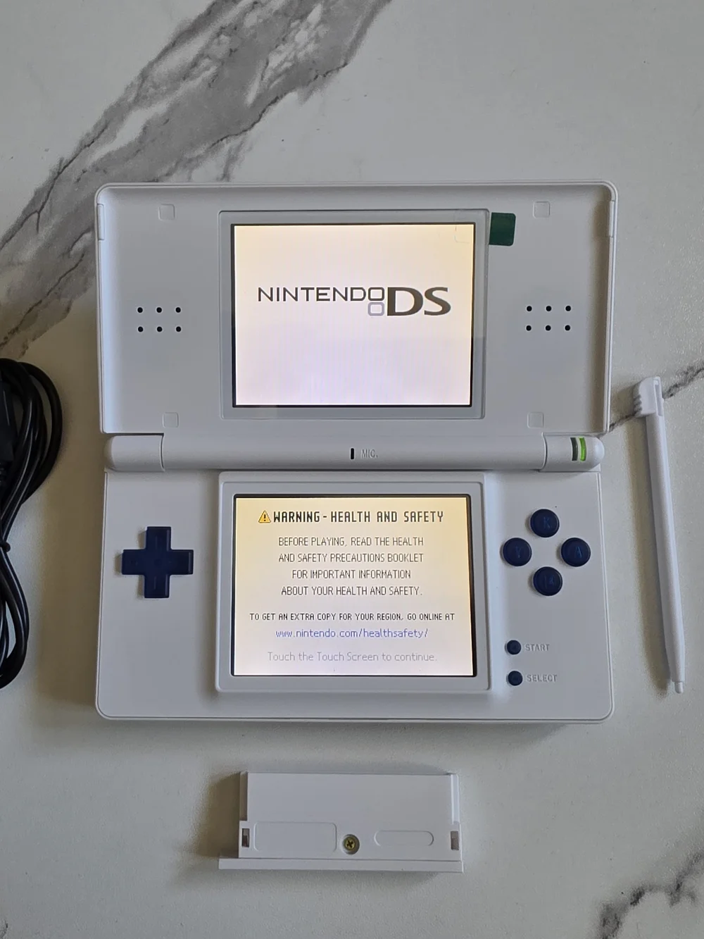 Nintendo White Handheld Console with Blue Controls